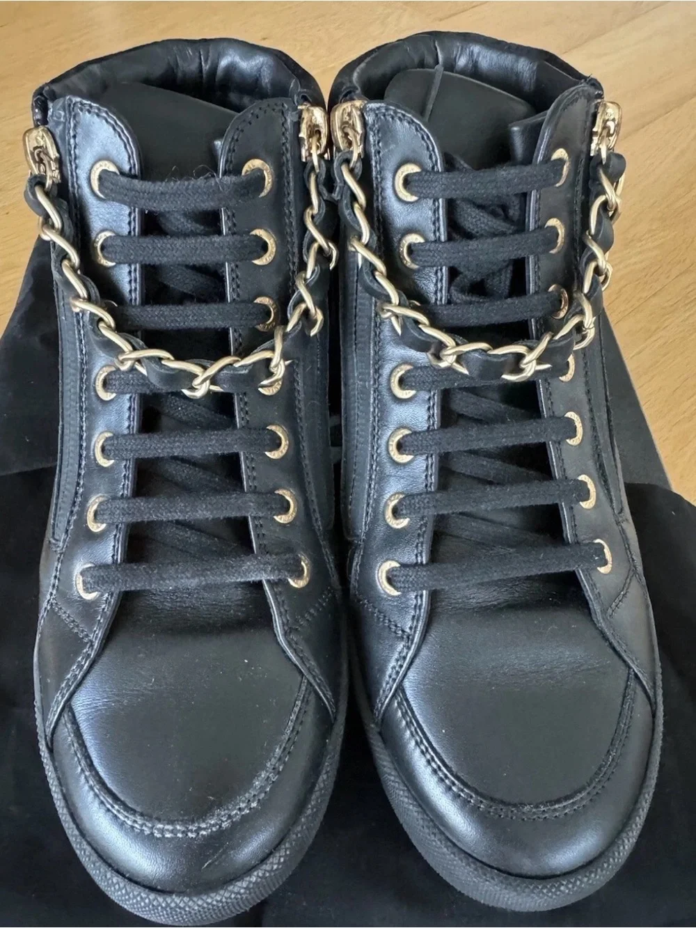 CHANEL Black Quilted High-Top Leather Sneakers with Gold Hardware